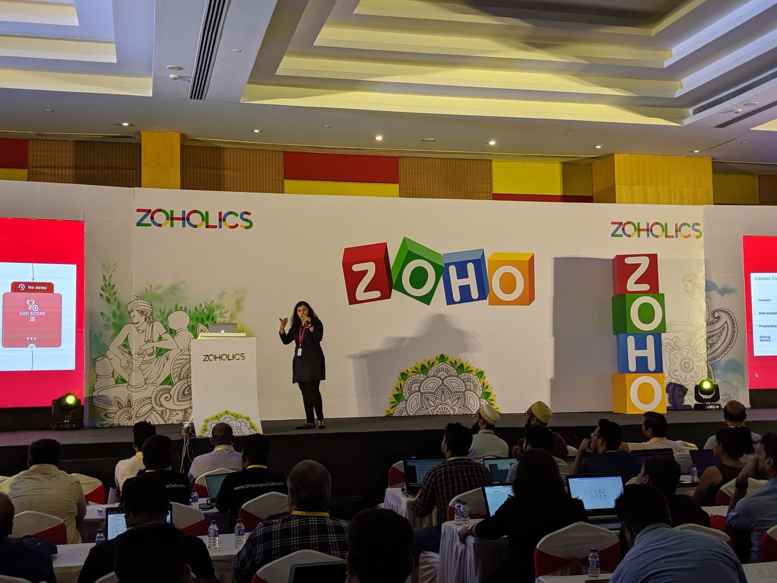 Aishwarya speaking on stage at Zoholics
